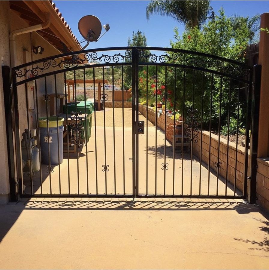 Custom double arched wrought iron driveway gates built by Fence Tech in Ramona, CA