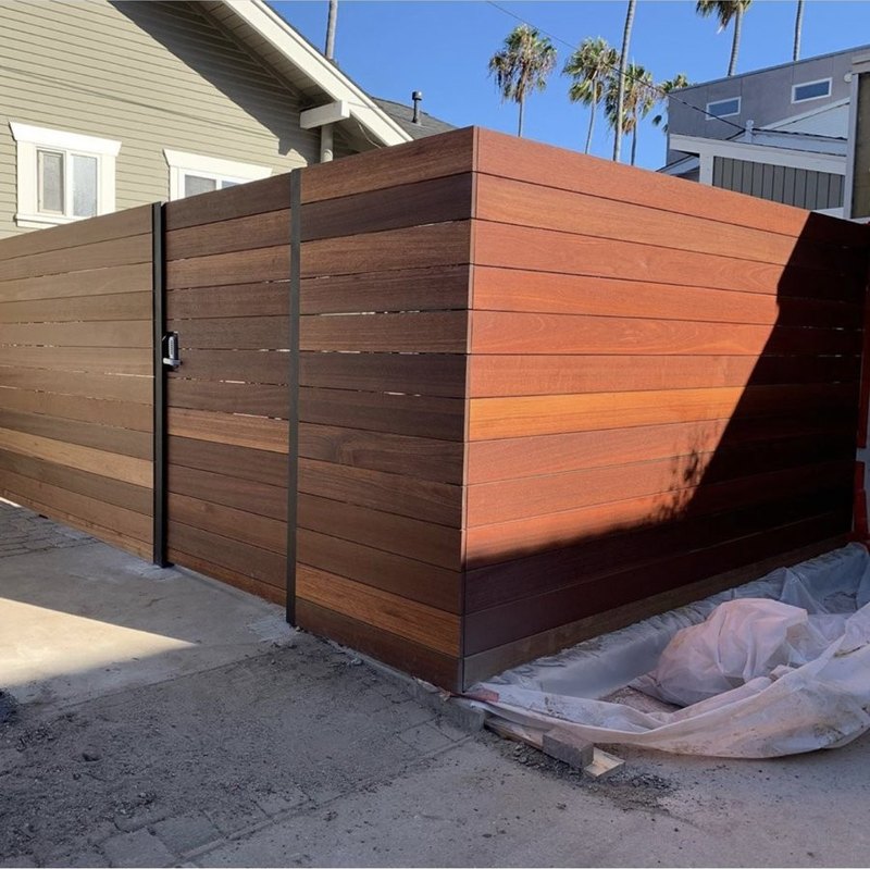 Horizontal redwood fence with matching custom wood gate built by Fence Tech